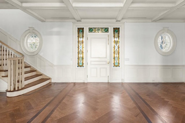 entryway with beam ceiling, parquet flooring, and coffered ceiling