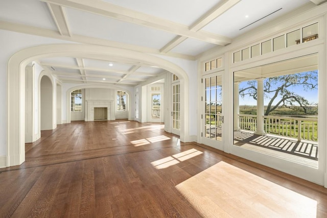 unfurnished sunroom with beam ceiling and coffered ceiling