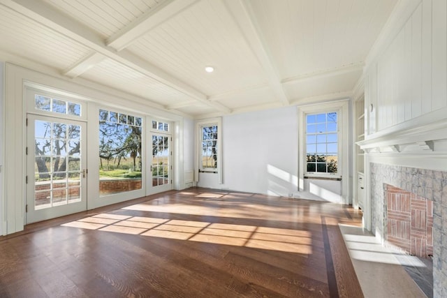 interior space featuring beam ceiling and hardwood / wood-style floors