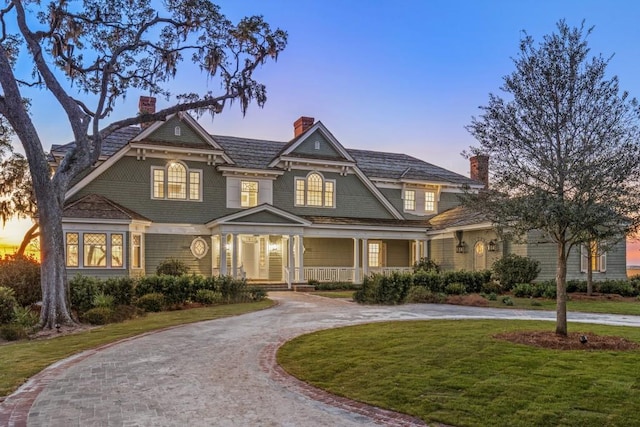 craftsman house featuring a lawn and a porch