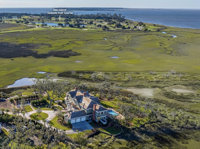 birds eye view of property featuring a water view and a rural view