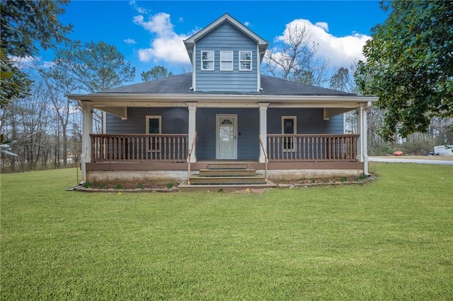 view of front of house with covered porch and a front lawn