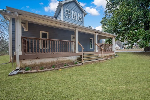 view of front of house with covered porch and a front yard