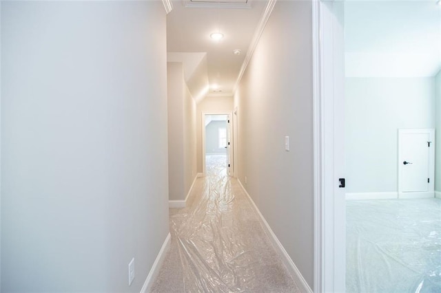 hall featuring ornamental molding