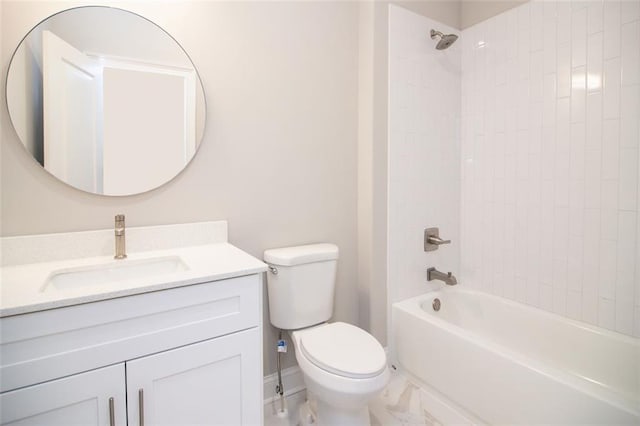 full bathroom featuring vanity, tiled shower / bath combo, and toilet