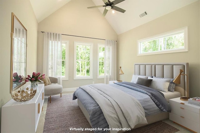 carpeted bedroom with ceiling fan and lofted ceiling