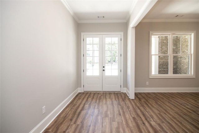 entryway featuring a healthy amount of sunlight, ornamental molding, and french doors