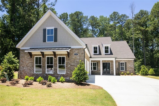 craftsman-style house with a front yard