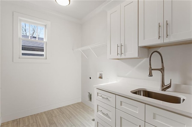 washroom with sink, cabinets, ornamental molding, hookup for a washing machine, and electric dryer hookup