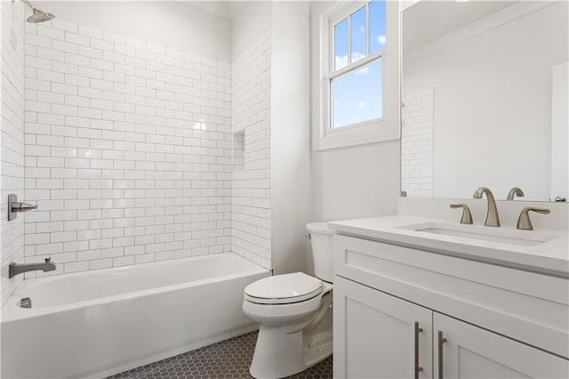 full bathroom featuring vanity, tiled shower / bath combo, tile patterned floors, and toilet