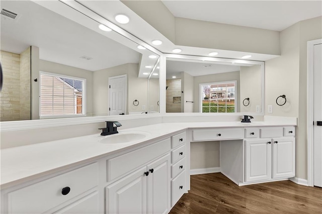 bathroom featuring vanity and wood-type flooring