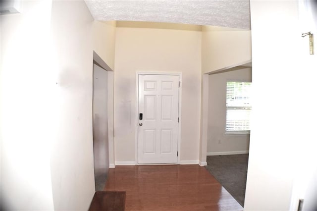 1371 Blazing Star Rd, Lawrenceville, GA 30045 - foyer featuring a textured ceiling and dark wood-style flooring