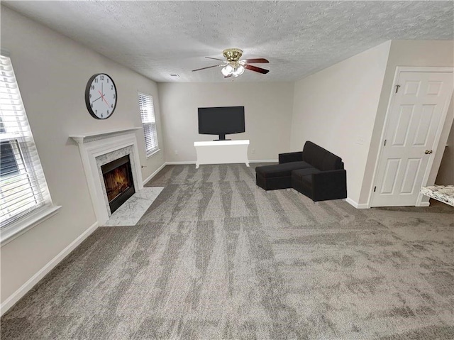 1371 Blazing Star Rd, Lawrenceville, GA 30045 - carpeted living area featuring a fireplace, ceiling fan, and a textured ceiling