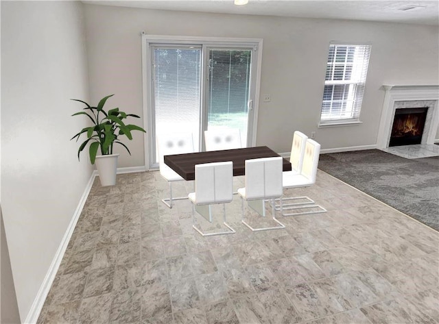 1371 Blazing Star Rd, Lawrenceville, GA 30045 - dining room featuring baseboards and a premium fireplace