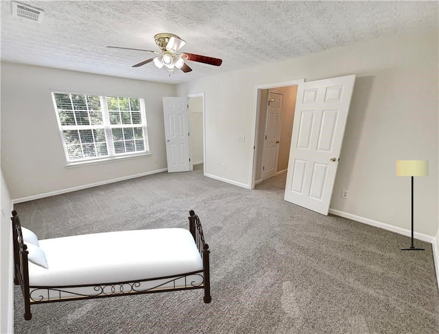 1371 Blazing Star Rd, Lawrenceville, GA 30045 - carpeted bedroom featuring a textured ceiling and a ceiling fan