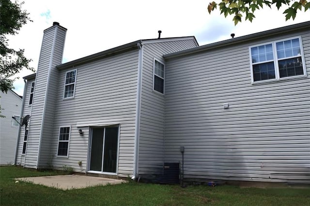 1371 Blazing Star Rd, Lawrenceville, GA 30045 - rear view of property featuring a chimney and a patio