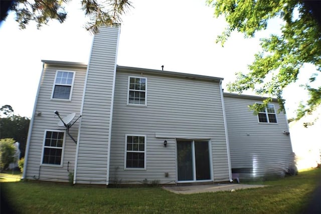 1371 Blazing Star Rd, Lawrenceville, GA 30045 - back of house with a chimney and a lawn