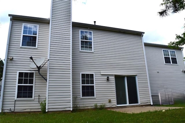 1371 Blazing Star Rd, Lawrenceville, GA 30045 - back of house featuring a chimney