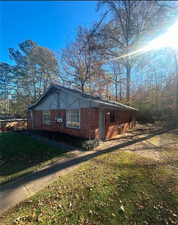 view of side of property with a yard