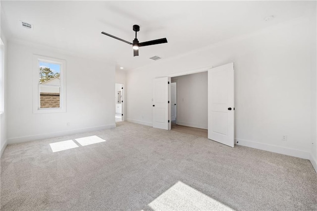 unfurnished bedroom with ceiling fan and light carpet