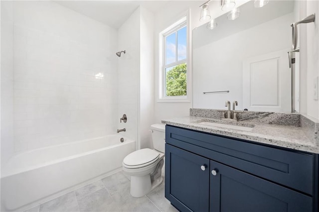 full bathroom with tiled shower / bath, vanity, and toilet