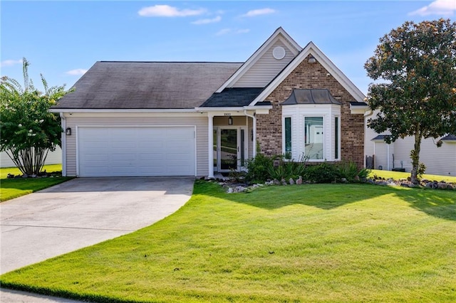 view of front of house featuring a front lawn and a garage