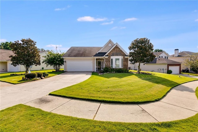 view of front of home featuring a garage and a front lawn