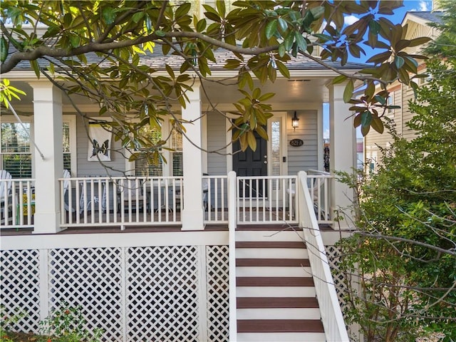 doorway to property featuring a porch