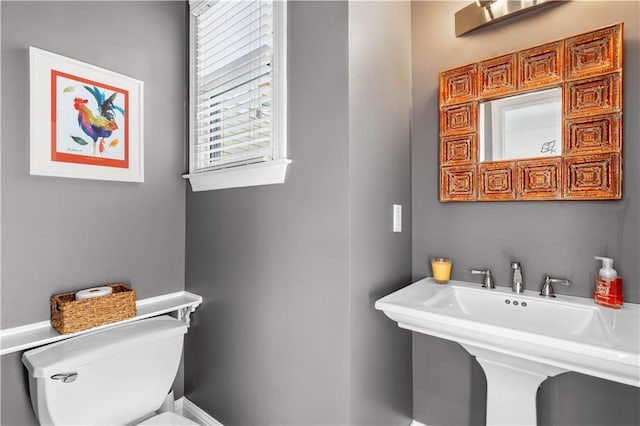 bathroom with sink and toilet