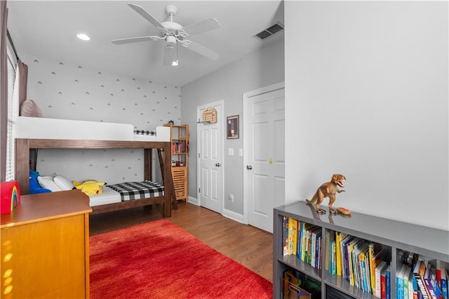 bedroom featuring wood-type flooring and ceiling fan