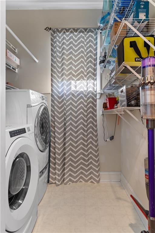 washroom featuring washer and clothes dryer