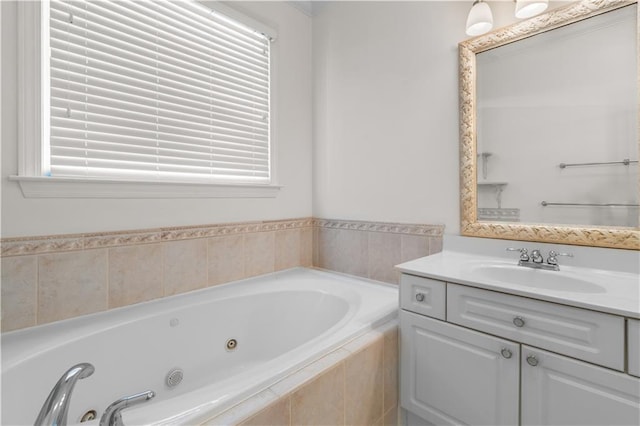 bathroom featuring vanity and tiled bath