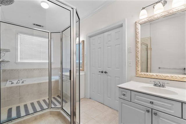 bathroom with ornamental molding, vanity, tile patterned floors, and walk in shower