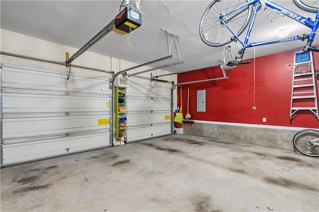 garage featuring a garage door opener and electric panel