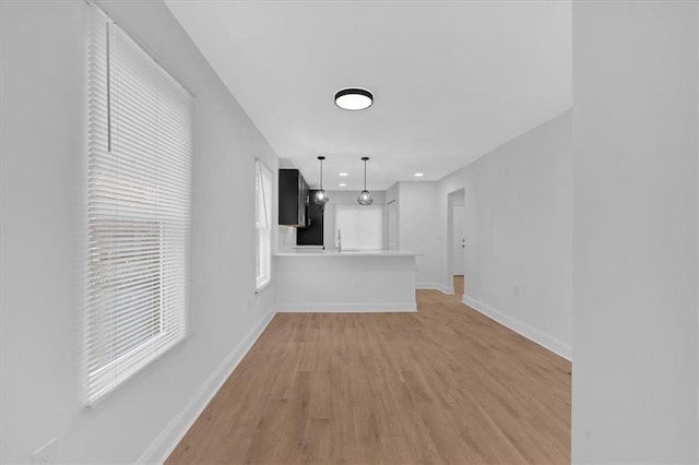 1222 E Forrest Ave, Atlanta, GA 30344 - unfurnished living room with light wood finished floors, baseboards, and recessed lighting