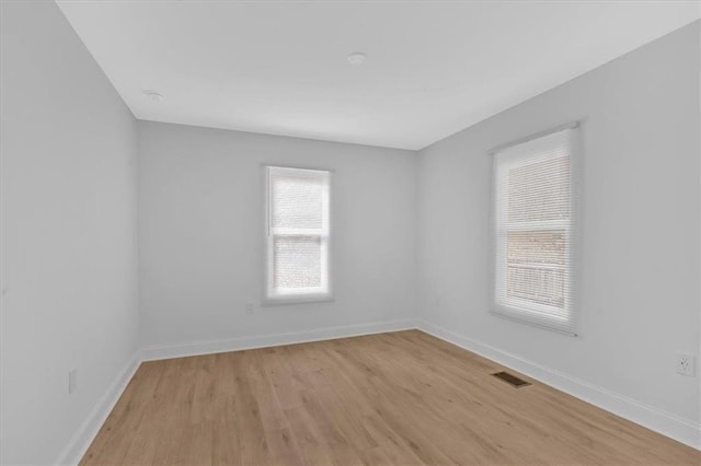 1222 E Forrest Ave, Atlanta, GA 30344 - unfurnished room featuring light wood-style flooring and baseboards