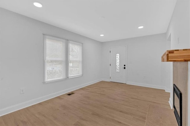 1222 E Forrest Ave, Atlanta, GA 30344 - foyer featuring light wood-type flooring, baseboards, a fireplace, and recessed lighting