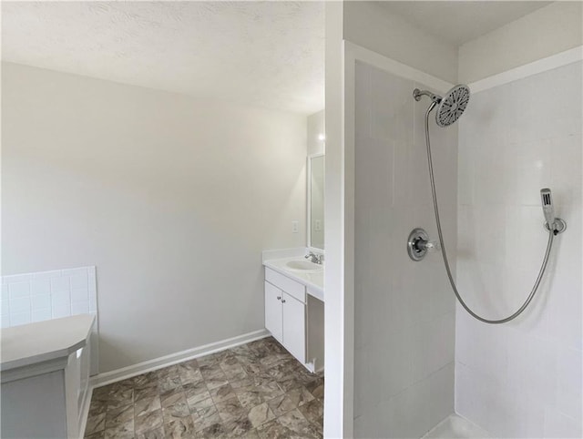 727 Overlook Crst, Monroe, GA 30655 - bathroom featuring tiled shower and vanity