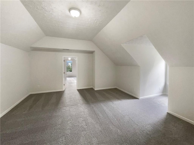 727 Overlook Crst, Monroe, GA 30655 - bonus room with carpet floors, lofted ceiling, a textured ceiling, and baseboards