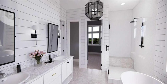0 Wynn Dr, Carrollton, GA 30117 - full bathroom featuring a soaking tub, double vanity, walk in shower, and a chandelier