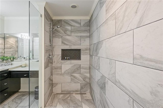 full bath with a stall shower, vanity, and ornamental molding