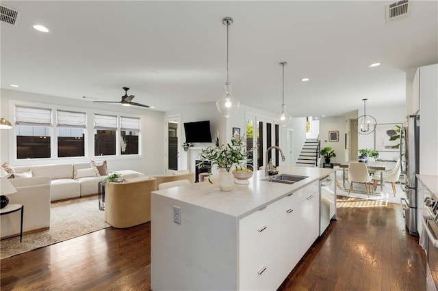 205 Wilbur Ave SE Unit A, Atlanta, GA 30316 - kitchen with visible vents, a sink, white cabinetry, and appliances with stainless steel finishes