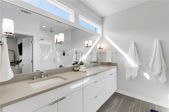 205 Wilbur Ave SE Unit A, Atlanta, GA 30316 - bathroom featuring a shower stall, a sink, visible vents, and double vanity