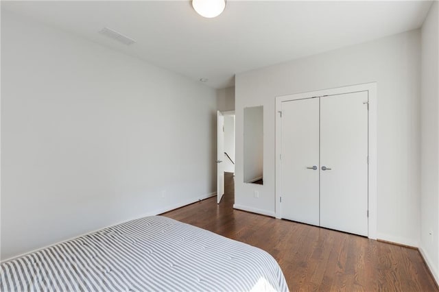 205 Wilbur Ave SE Unit A, Atlanta, GA 30316 - bedroom featuring visible vents, baseboards, wood finished floors, and a closet