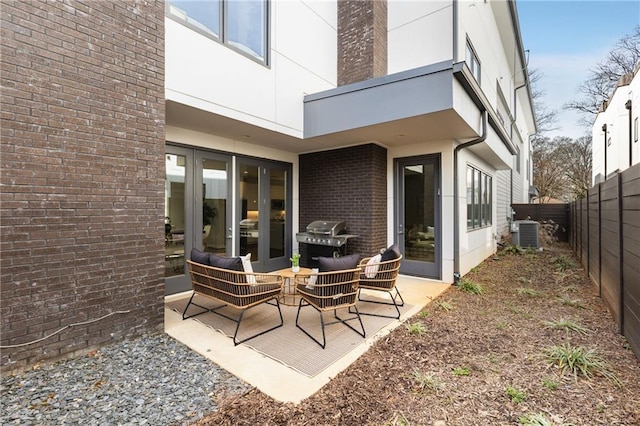 205 Wilbur Ave SE Unit A, Atlanta, GA 30316 - view of patio featuring a fenced backyard, central AC unit, outdoor lounge area, and area for grilling