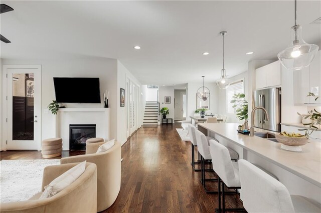 205 Wilbur Ave SE Unit A, Atlanta, GA 30316 - living room with dark wood-style floors, visible vents, a glass covered fireplace, recessed lighting, and stairs