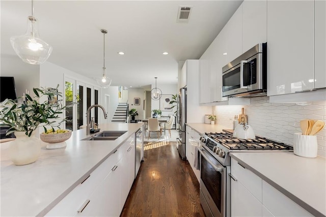 205 Wilbur Ave SE Unit A, Atlanta, GA 30316 - kitchen featuring a sink, light countertops, appliances with stainless steel finishes, dark wood-type flooring, and visible vents