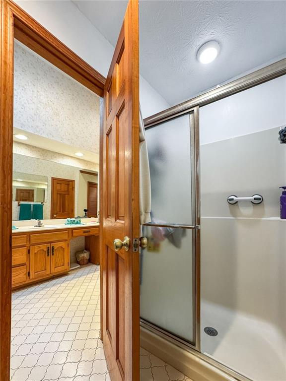 110 The Farm Rd, Mcdonough, GA 30252 - full bathroom with a shower stall and vanity