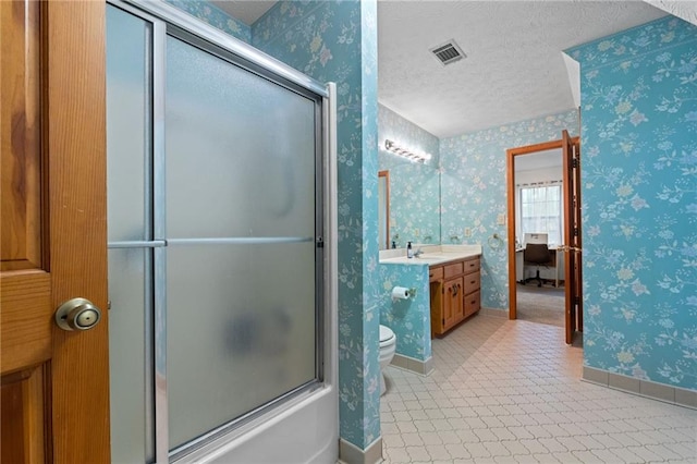 110 The Farm Rd, Mcdonough, GA 30252 - full bath featuring a textured ceiling, visible vents, baseboards, vanity, and toilet