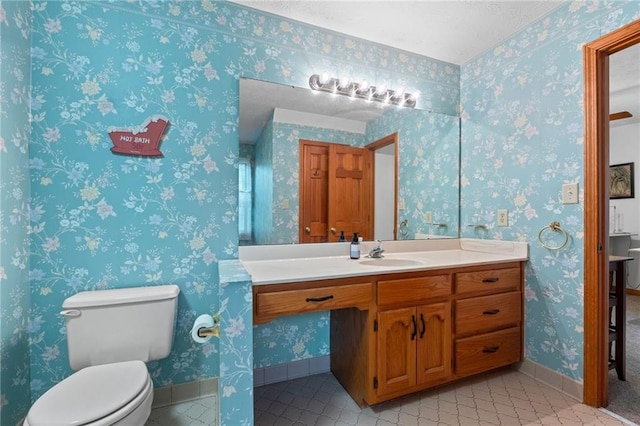 110 The Farm Rd, Mcdonough, GA 30252 - bathroom featuring vanity, toilet, baseboards, a textured ceiling, and tile patterned floors